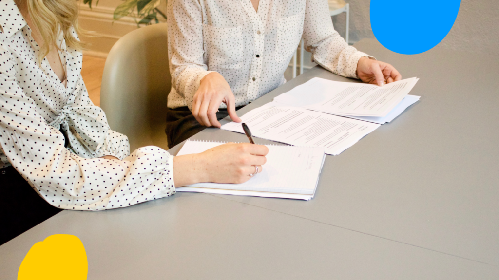 2 woman with documents