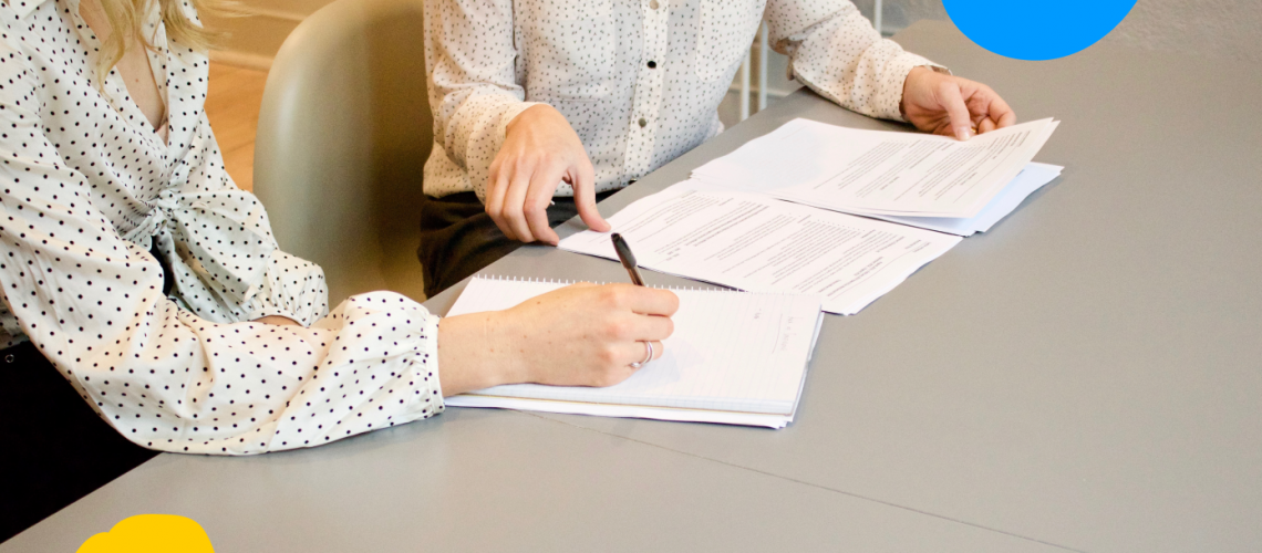 2 woman with documents