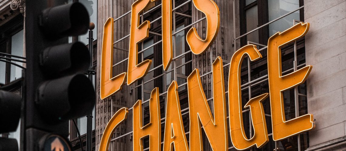 brad-starkey-5qFGBb4yUyk-unsplash sign on a building