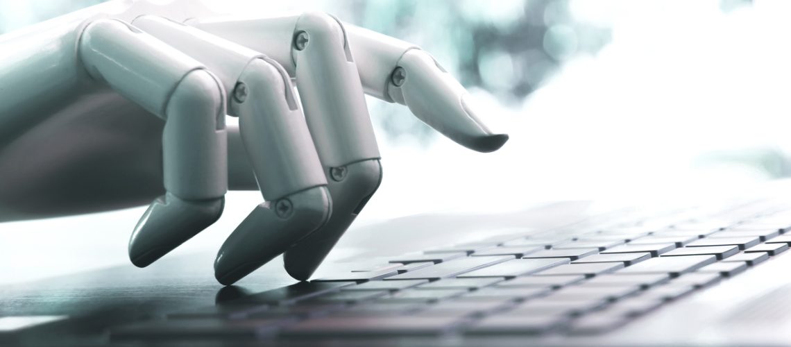 Robot concept or robot hand chatbot pressing computer keyboard enter