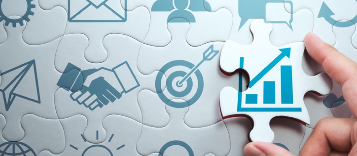 Business development concept. Finding solution to growth. Connecting last jigsaw puzzle piece.