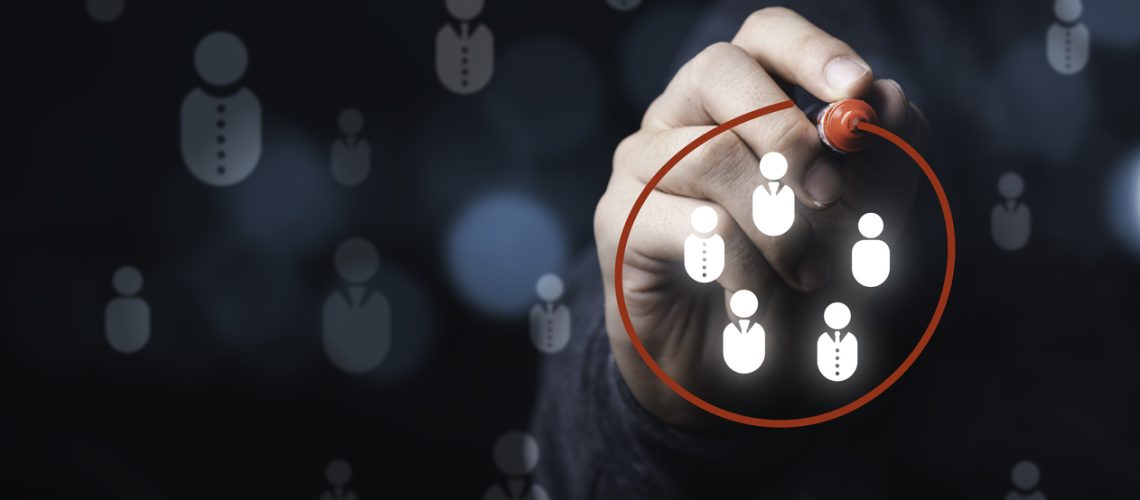 Businessman drawing red circle to marking and select human icons , Human development or marketing focus customer target group.