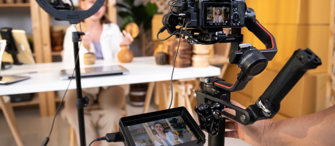 Behind the scenes of A young pretty woman entrepreneur live streaming to sale craft products to customers via filming professional camera Behind the scenes of A young pretty woman entrepreneur live streaming to sale craft products to customers via filming professional camera