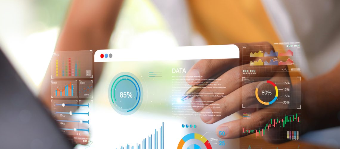 Data analyst working on business analytics dashboard with charts, with KPI and metrics connected to the database for technology finance, operations, sales, marketing